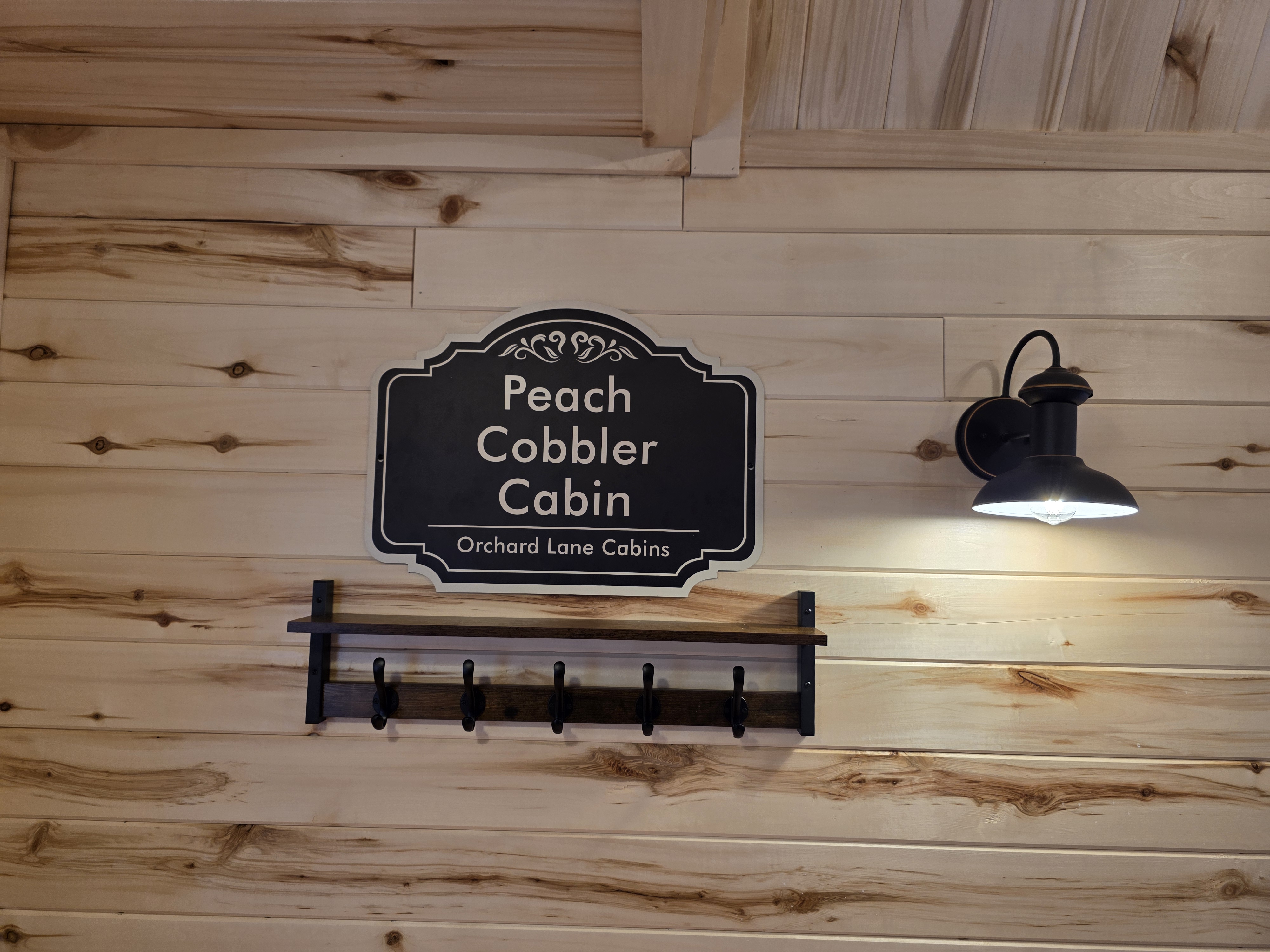 Intro sign for Peach Cobbler Cabin