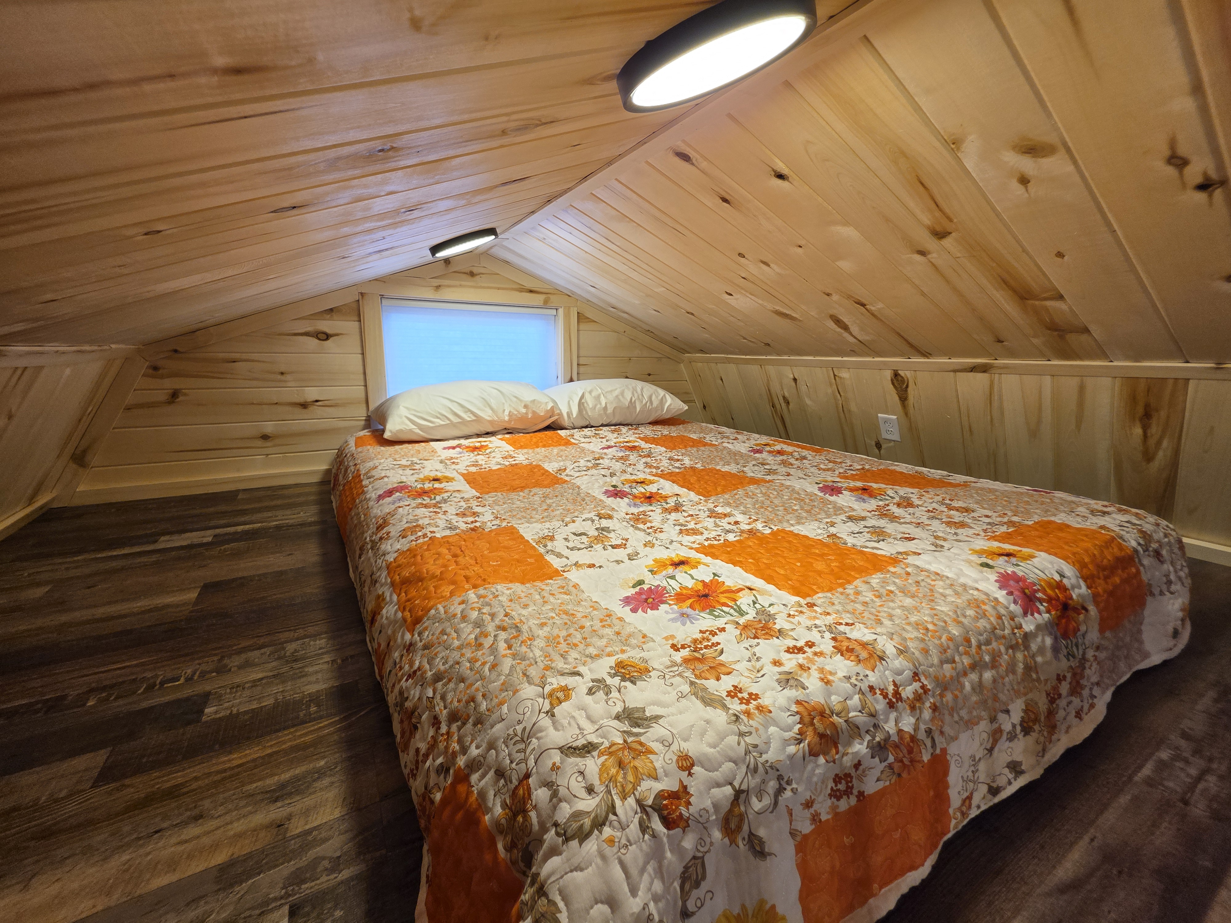 Second floor queen bed in Peach Cobbler Cabin